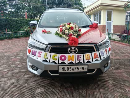 A decorated Innova Crysta ready for a family welcome in Shillong